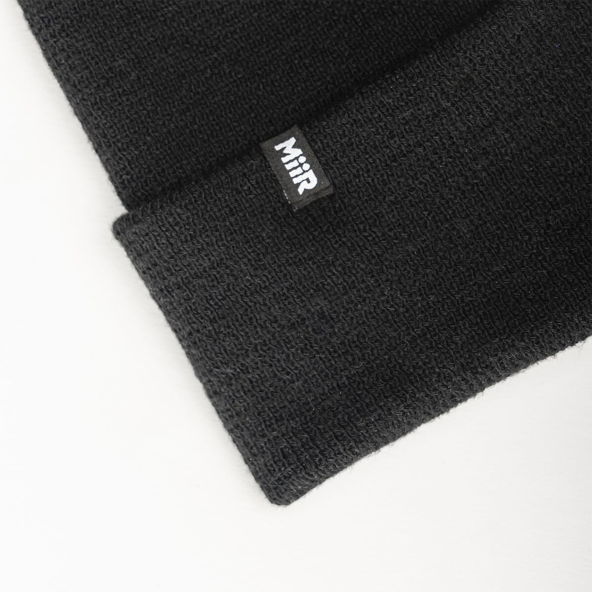 recycled-poly-fine-knit-beanie-n5 WebPDP-RecycledPolyFineKnitBeanie_Studio_TagDetail_Black__BNE005002OS.jpg