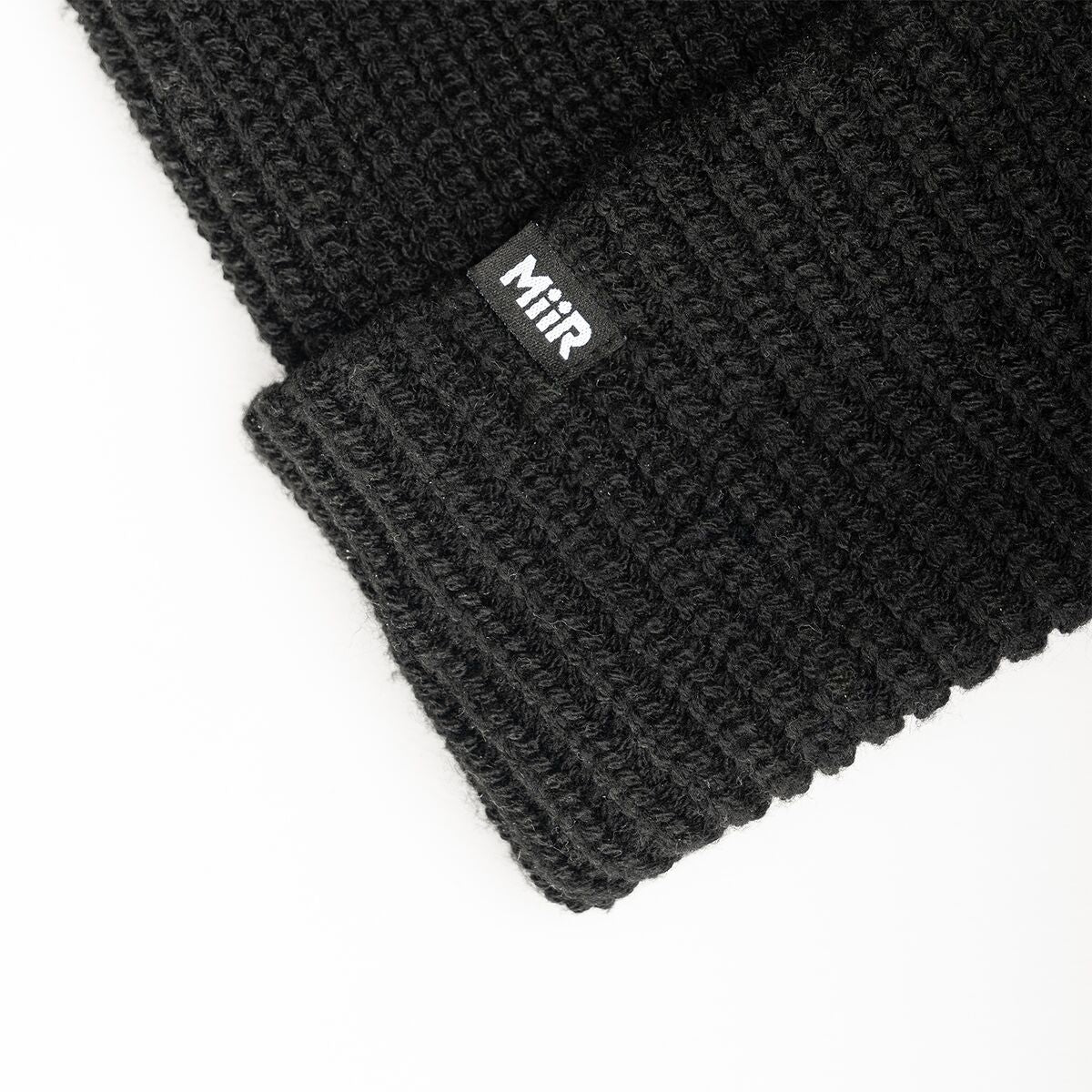recycled-poly-rib-beanie-t6 WebPDP-RecycledPolyRibBeanie_Studio_TagDetail_Black__BNE002002OS.jpg